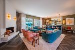 Formal Living Room Features Custom Wet Bar, Fireplace, Pool And Mountain Views
